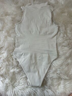 Sleeveless Ribbed High-Neck Cream Bodysuit